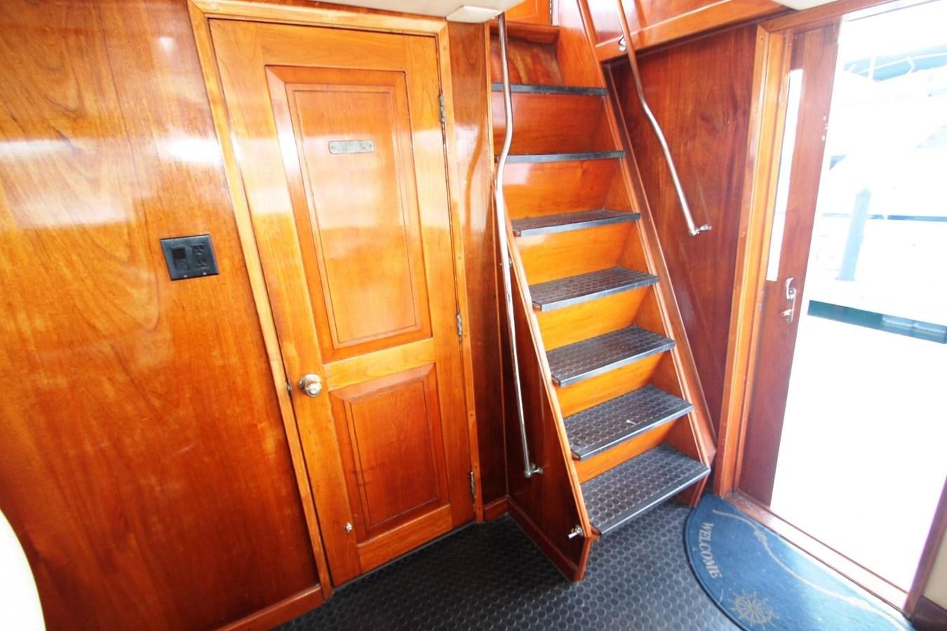 a wooden cabinet with drawers aboard ENCHANTRESS Yacht for Sale