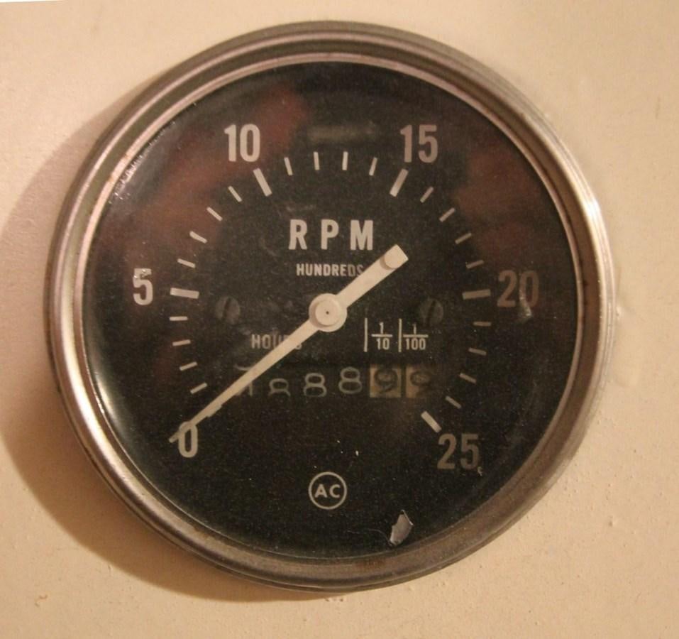 a round black analog clock aboard ENCHANTRESS Yacht for Sale