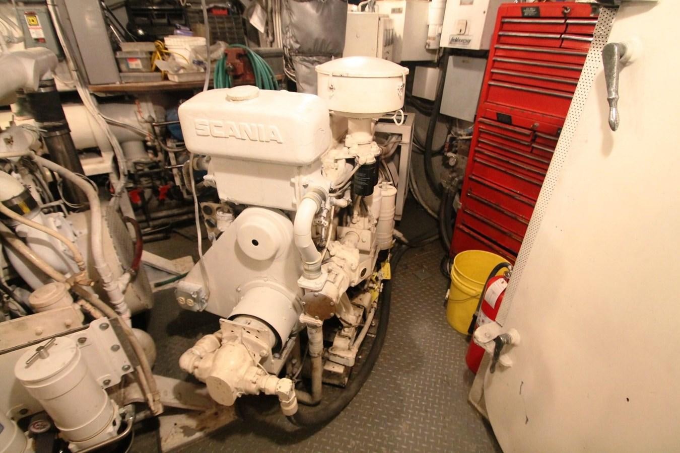 a white motorbike in a garage aboard ENCHANTRESS Yacht for Sale
