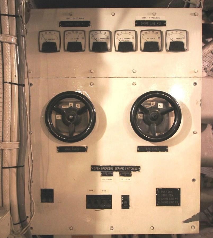 a white electrical box with a black dial and a black dial aboard ENCHANTRESS Yacht for Sale