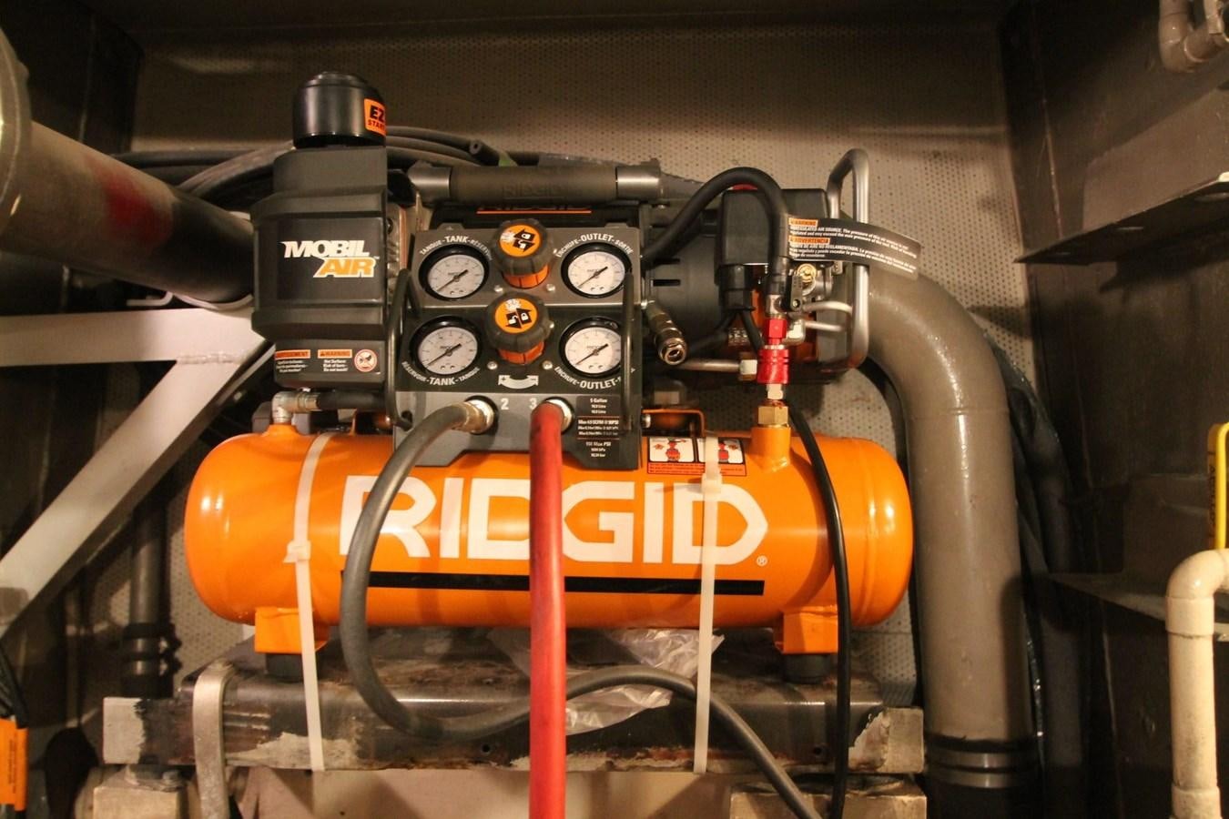 a machine with a large orange pipe aboard ENCHANTRESS Yacht for Sale