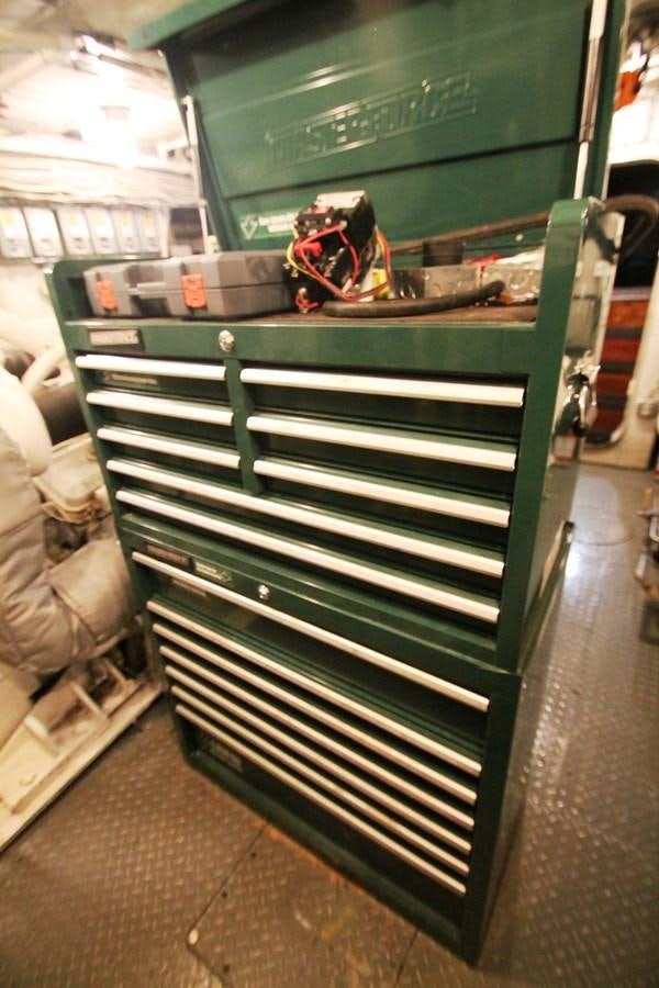a green metal shelf with a green rectangular object on it aboard ENCHANTRESS Yacht for Sale