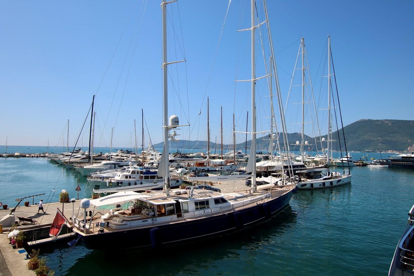 a boat docked at a pier aboard CYRANO DE BERGERAC Yacht for Sale
