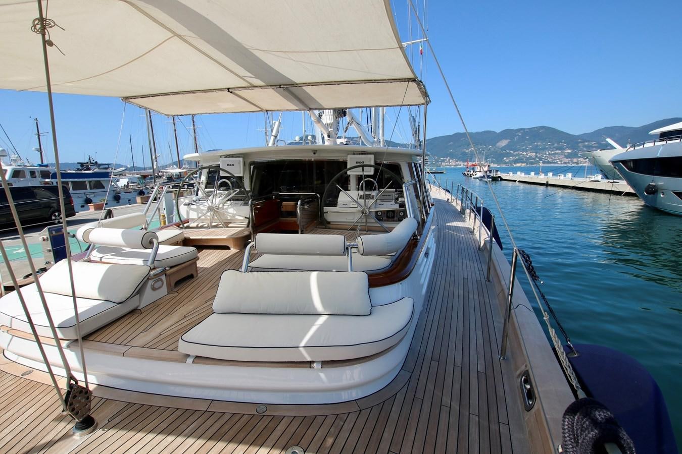 a boat docked at a pier aboard CYRANO DE BERGERAC Yacht for Sale