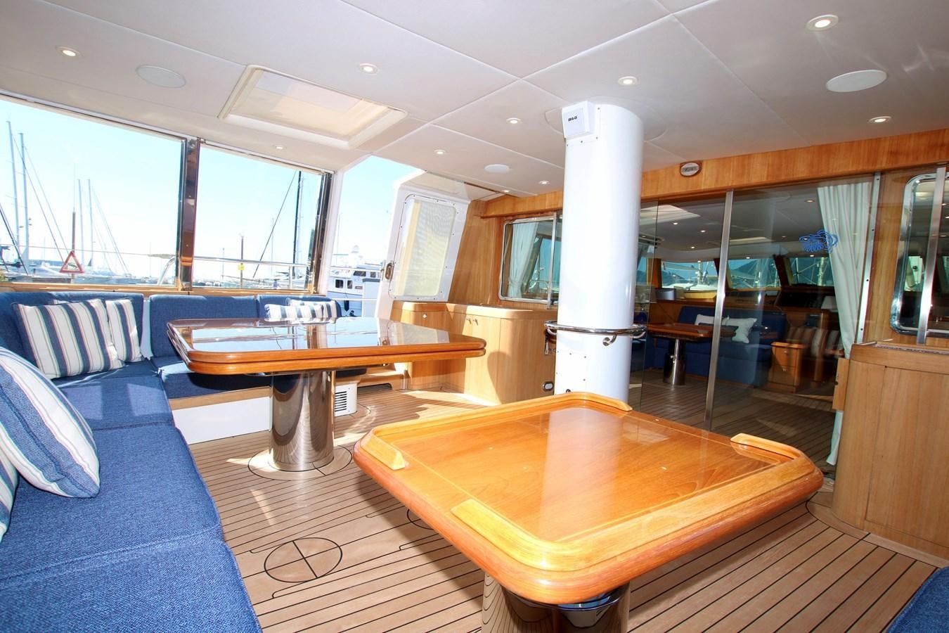a room with a table and chairs aboard CYRANO DE BERGERAC Yacht for Sale