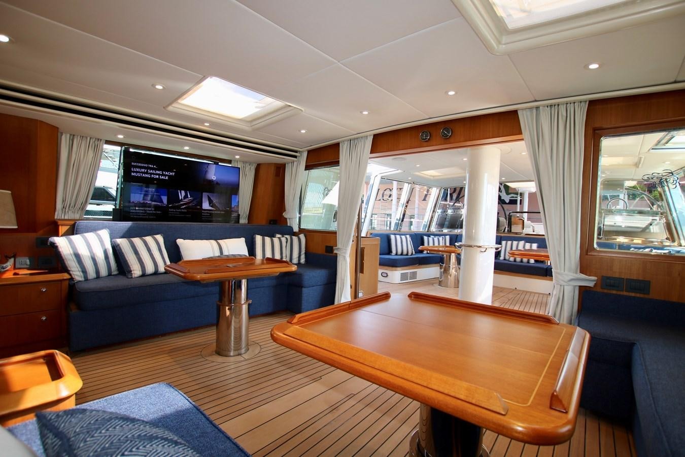 a room with a couch and a table aboard CYRANO DE BERGERAC Yacht for Sale