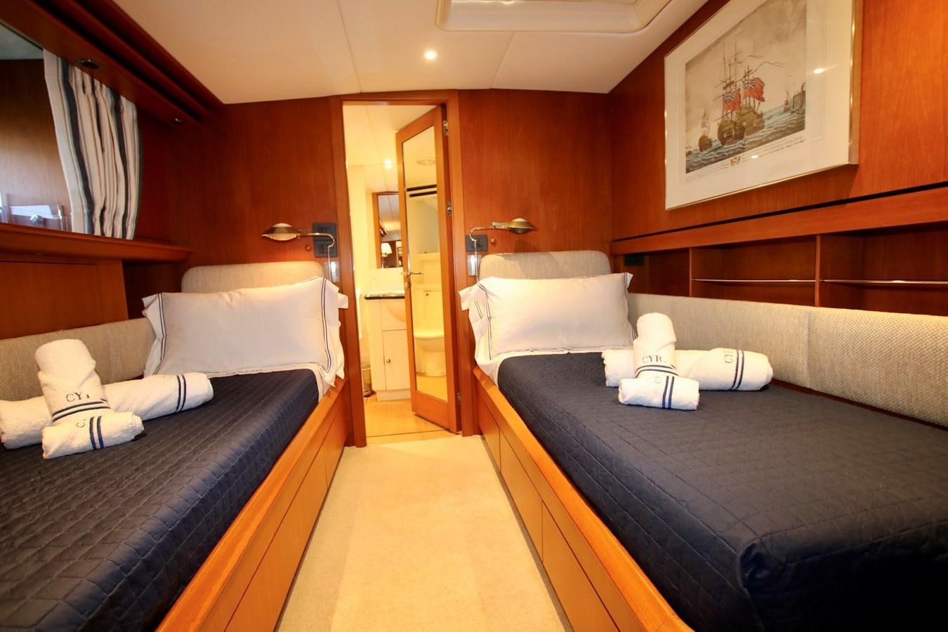 a room with beds and a mirror aboard CYRANO DE BERGERAC Yacht for Sale