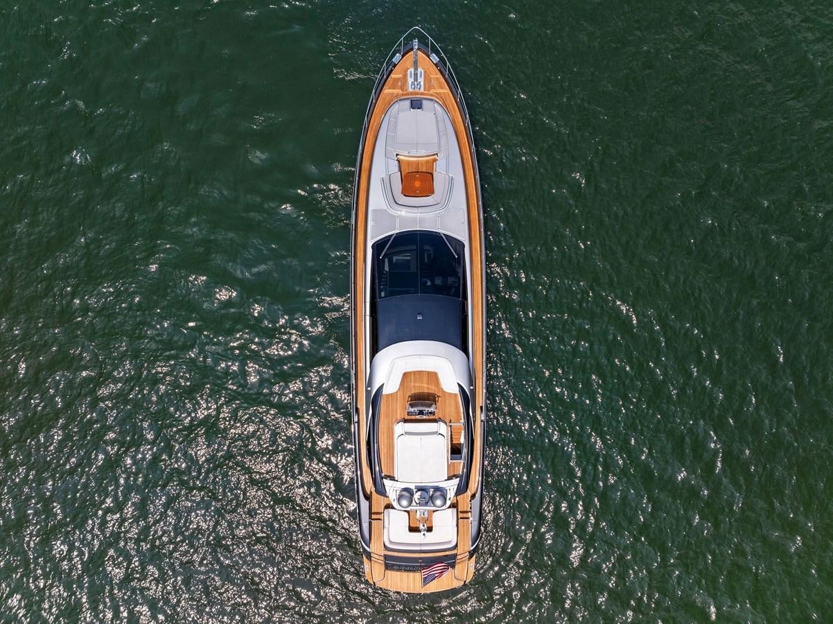 a yellow and black boat in the water aboard INDISCRETION Yacht for Sale