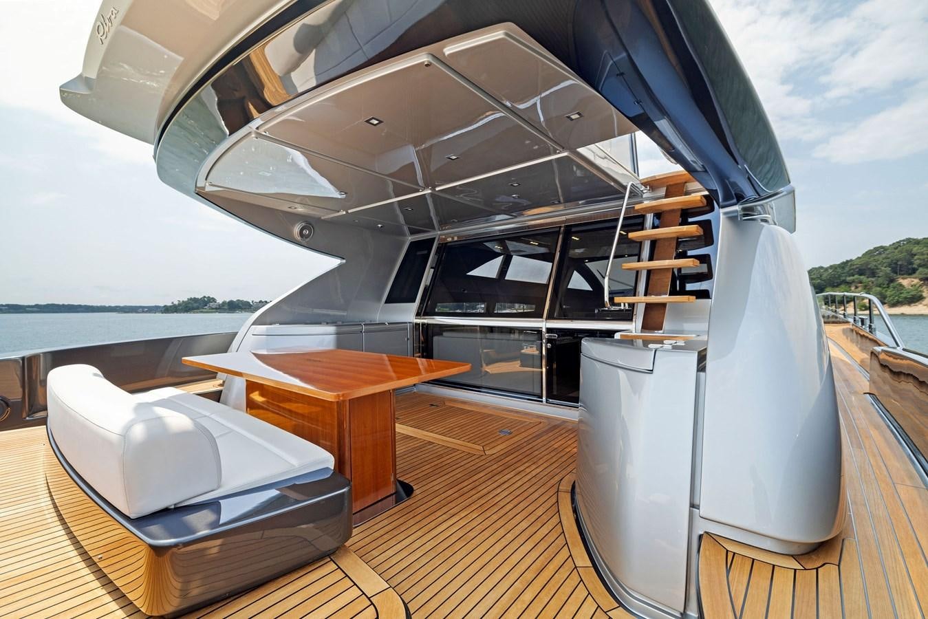 a room with a large white and black roof and a large white building with a large white dome aboard INDISCRETION Yacht for Sale