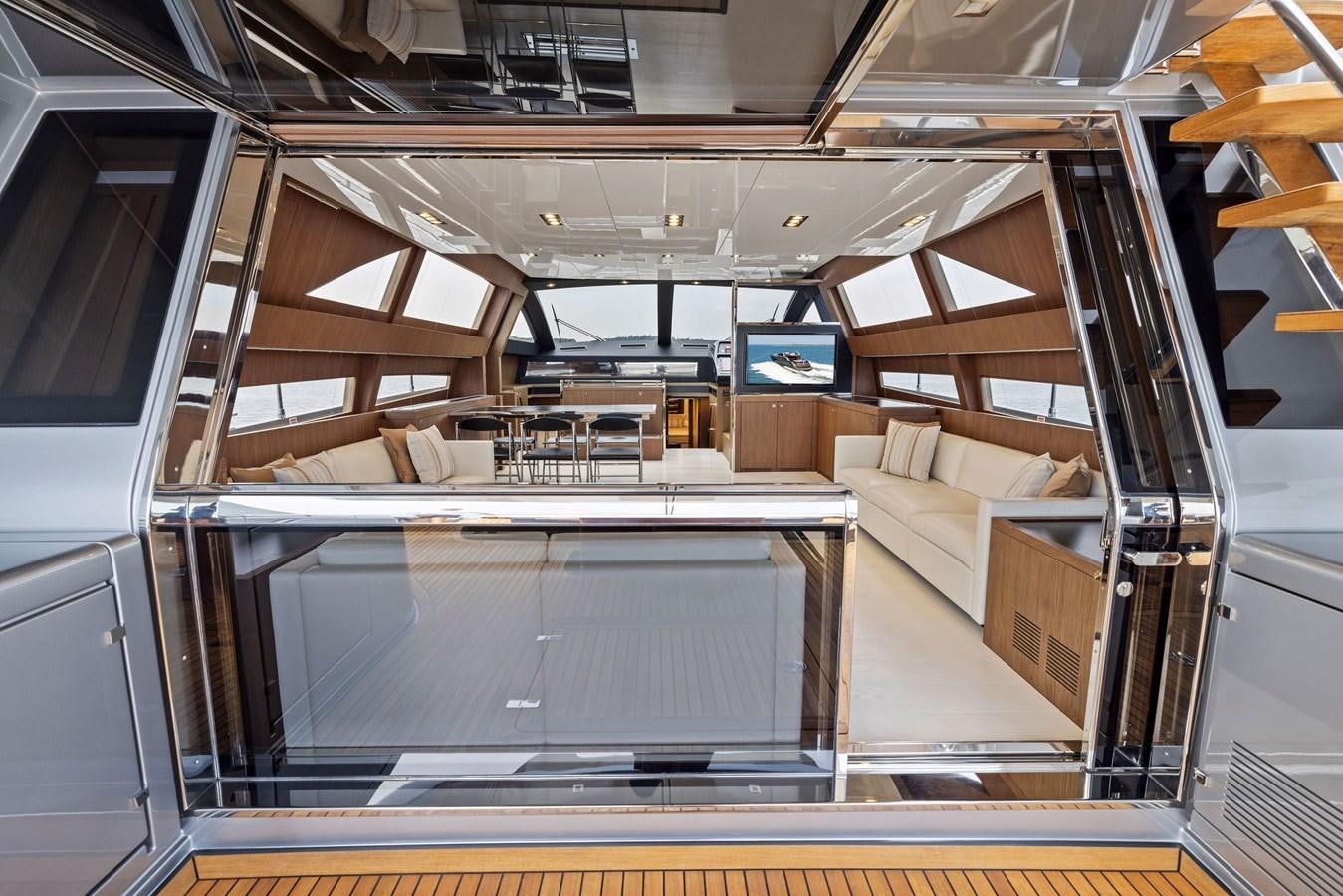 a room with a large staircase aboard INDISCRETION Yacht for Sale