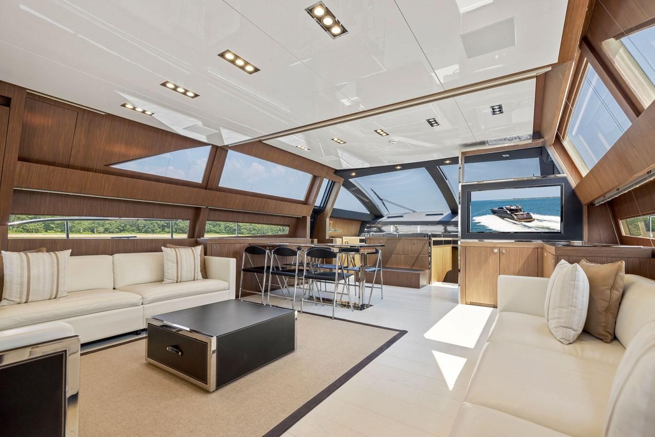 a room with a couch and a table aboard INDISCRETION Yacht for Sale