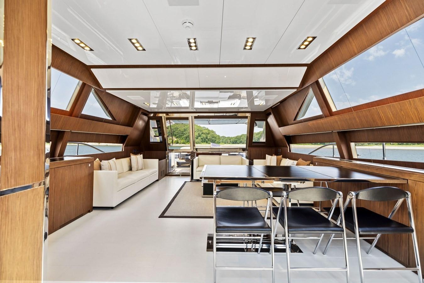 a room with a table and chairs aboard INDISCRETION Yacht for Sale