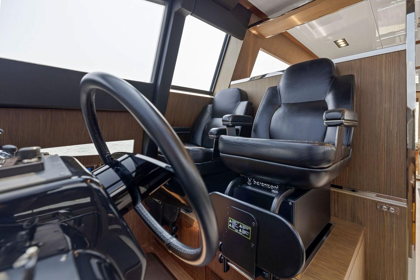 a black and silver office chair aboard INDISCRETION Yacht for Sale