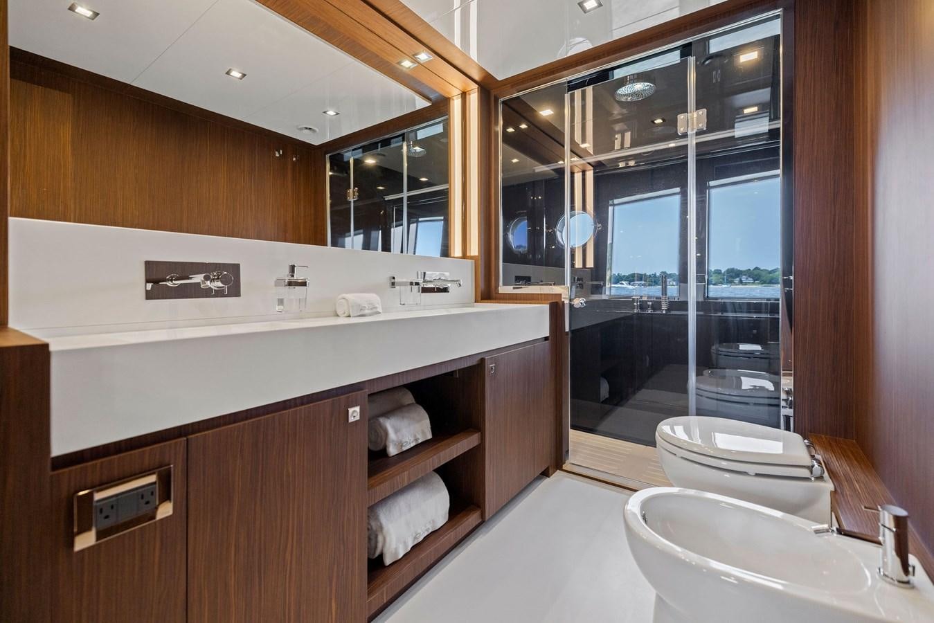 a bathroom with a large mirror aboard INDISCRETION Yacht for Sale