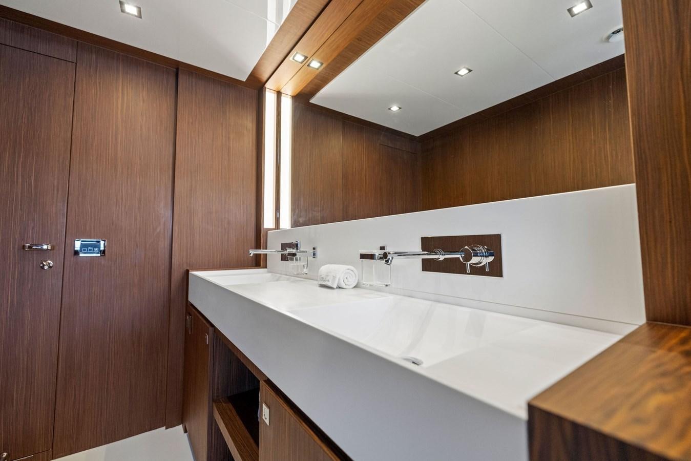 a bathroom with a large sink aboard INDISCRETION Yacht for Sale