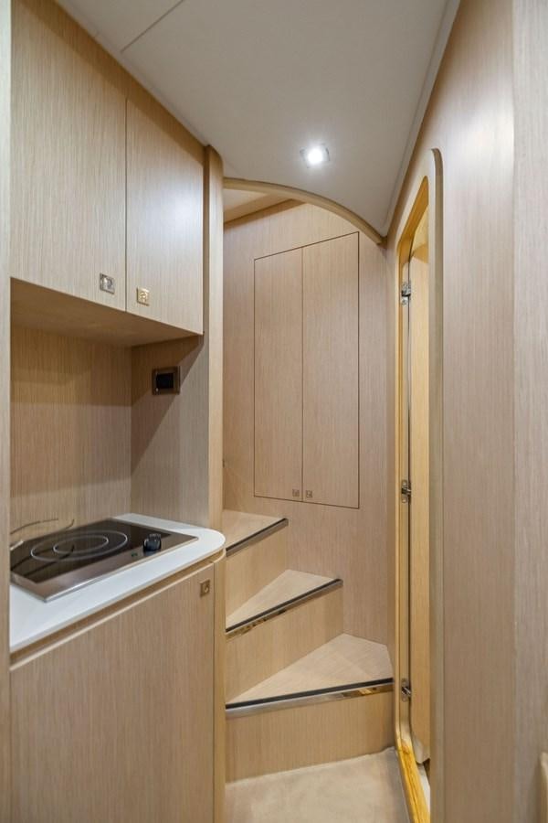 a kitchen with a stove and cabinets aboard INDISCRETION Yacht for Sale