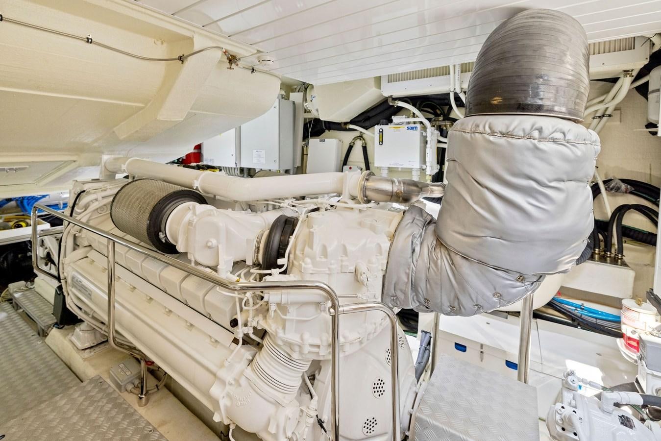 a person in a room with a large white machine aboard INDISCRETION Yacht for Sale