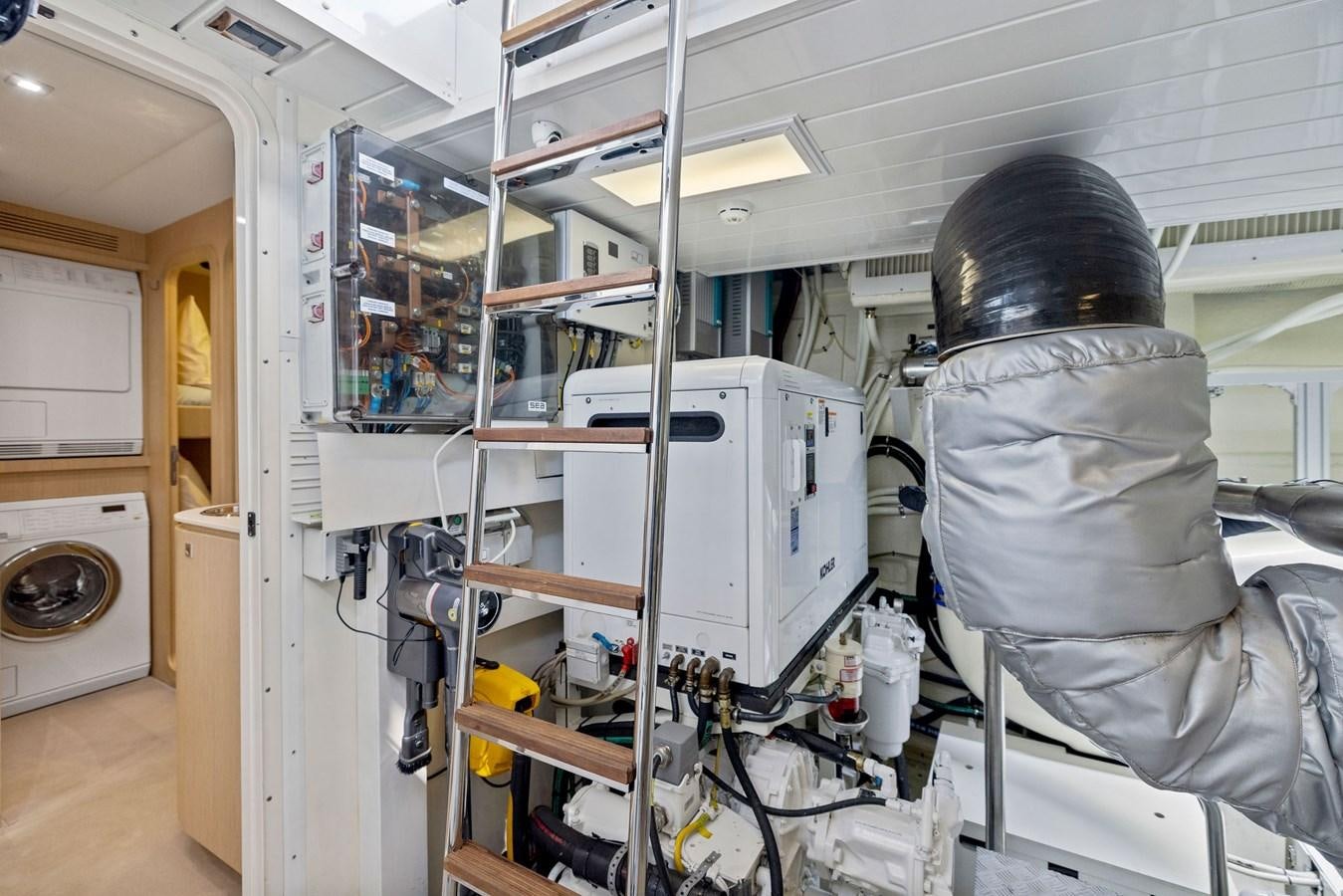 a person in a mask in a room with equipment aboard INDISCRETION Yacht for Sale