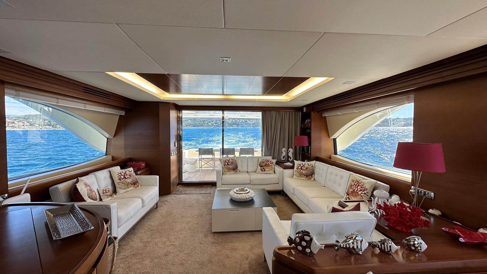 a living room with a large window aboard EVA Yacht for Sale