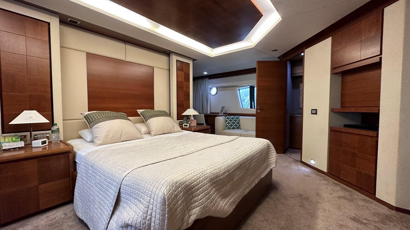 a large bedroom with a bed aboard EVA Yacht for Sale