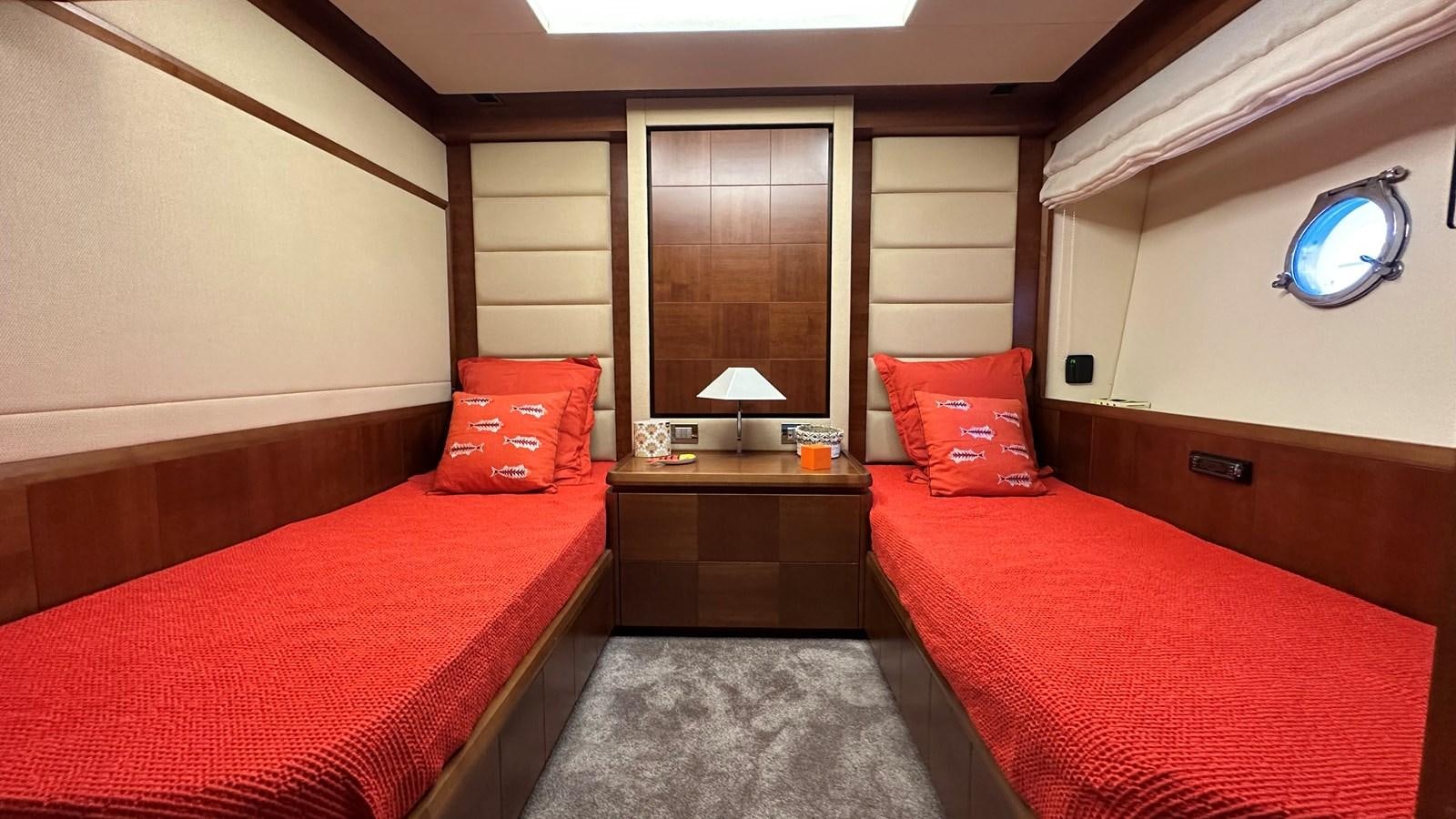 a room with a bed and a desk aboard EVA Yacht for Sale