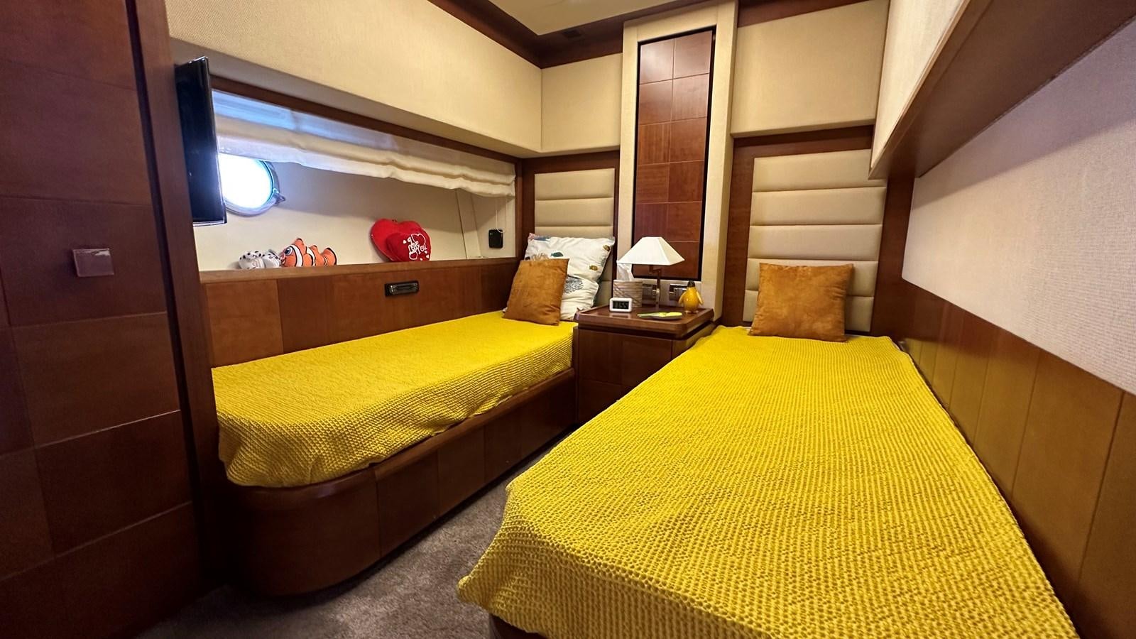 a room with two beds aboard EVA Yacht for Sale
