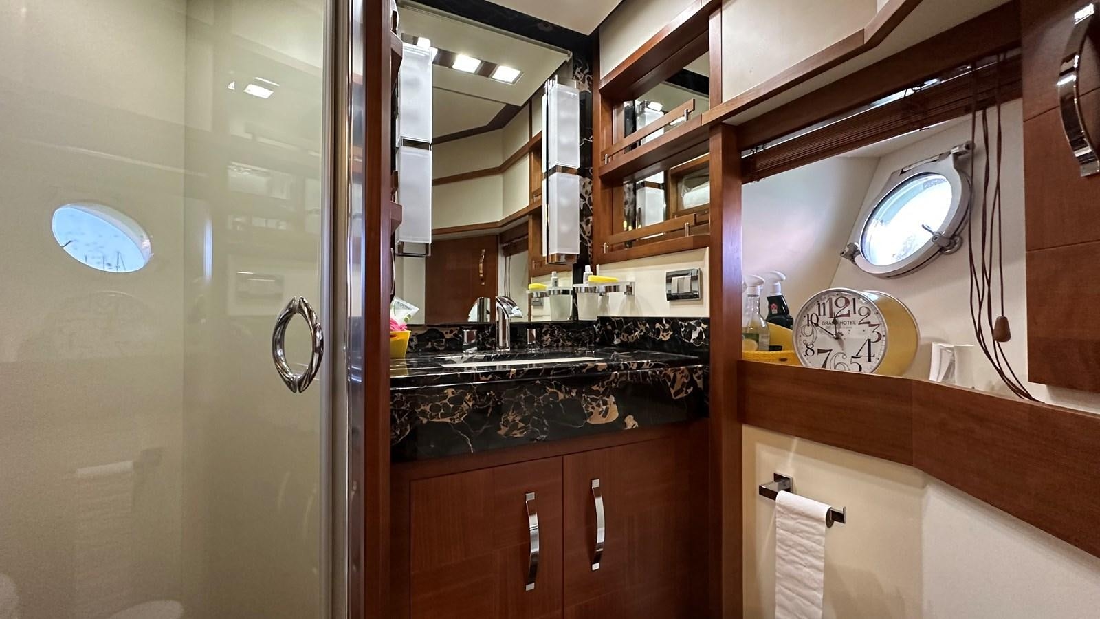 a bathroom with a large mirror aboard EVA Yacht for Sale