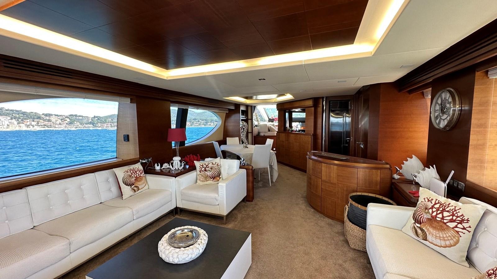 a living room with a large window aboard EVA Yacht for Sale