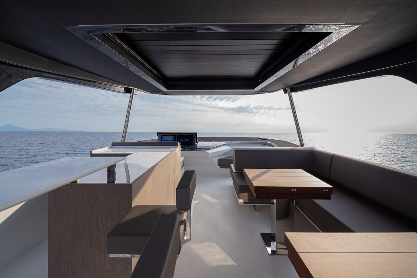 a deck with a view of the ocean and the ocean aboard ASTO82AS8724 Yacht for Sale