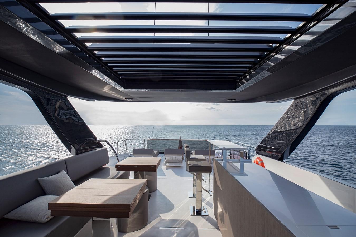 a deck with a view of the ocean and a boat aboard ASTO82AS8724 Yacht for Sale