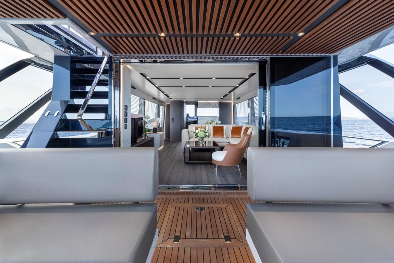 a room with a wood floor and a staircase aboard ASTO82AS8724 Yacht for Sale