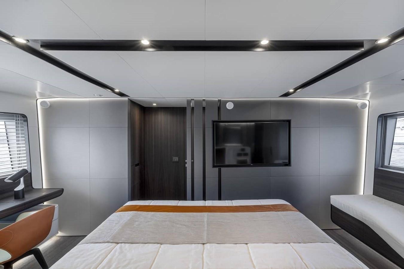 a room with a bed and a tv aboard ASTO82AS8724 Yacht for Sale