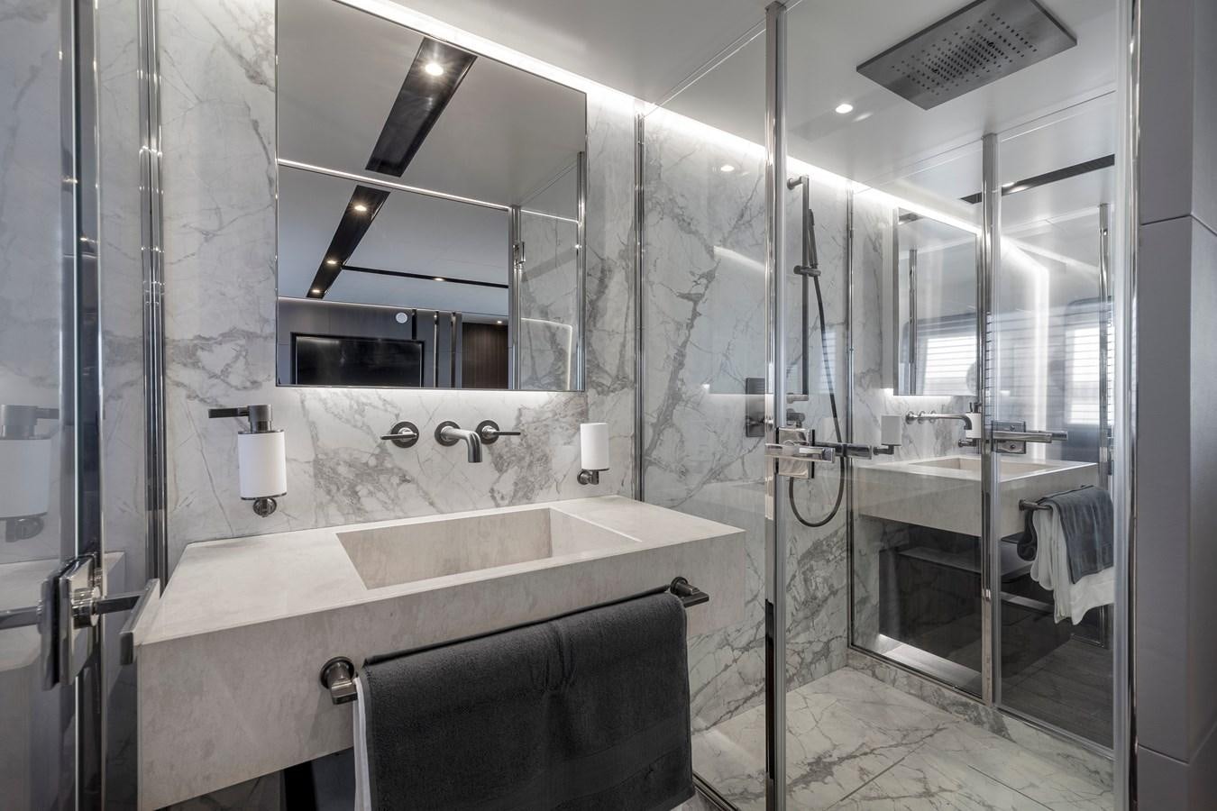 a bathroom with a tub sink and shower aboard ASTO82AS8724 Yacht for Sale