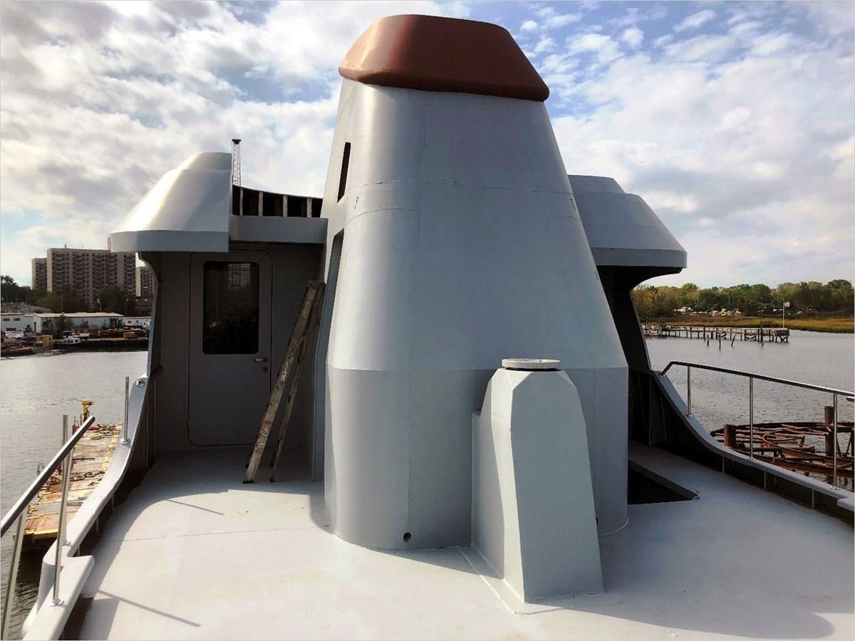 a white cylindrical object on a dock aboard SEA MONSTER Yacht for Sale