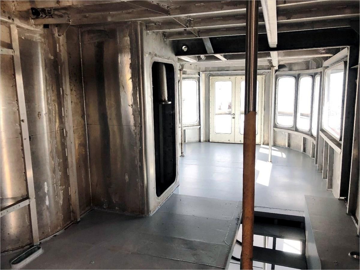 a room with wood floors and a wood floor aboard SEA MONSTER Yacht for Sale