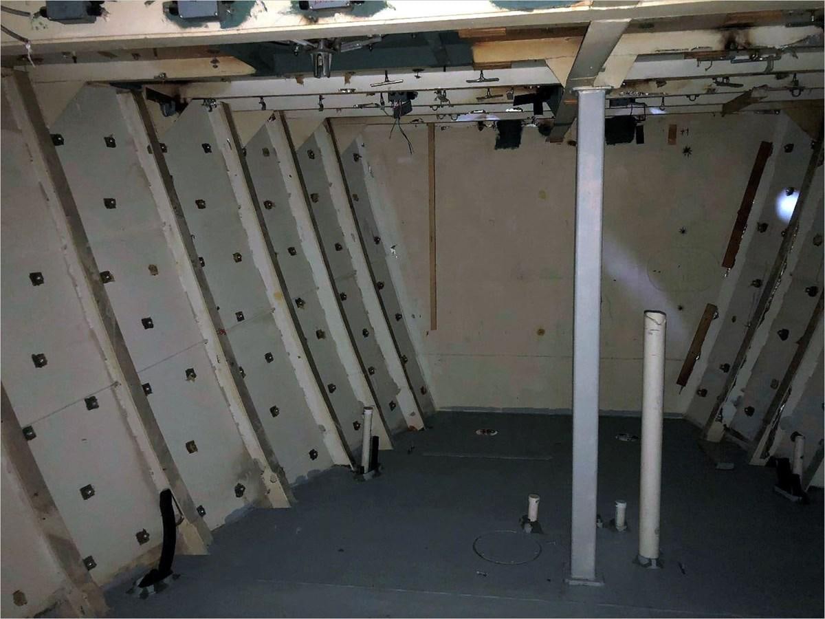 a room with pipes and a wall aboard SEA MONSTER Yacht for Sale