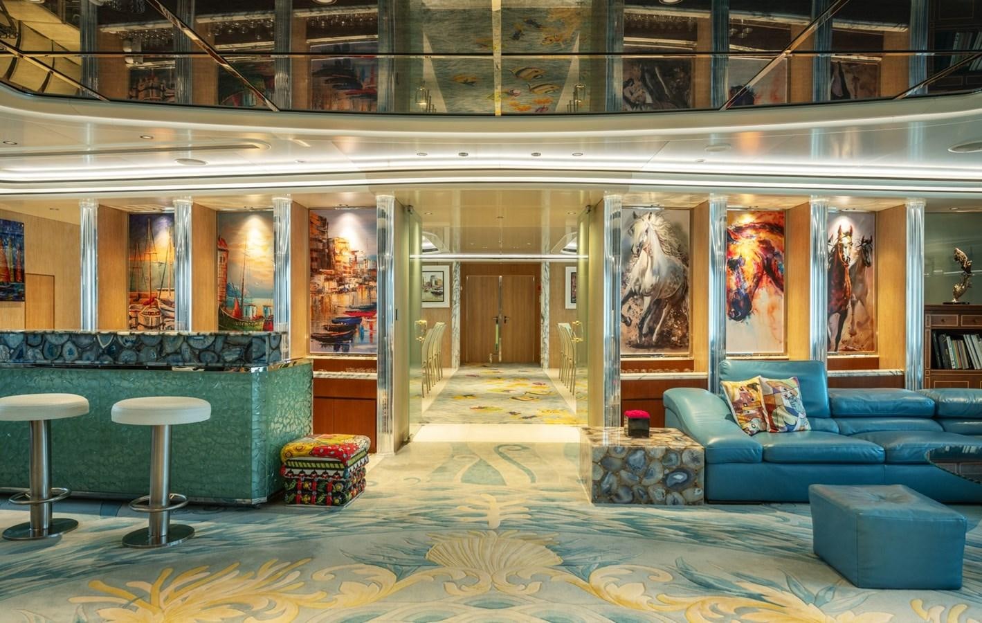 a room with a couch and a table aboard MOONLIGHT II Yacht for Sale