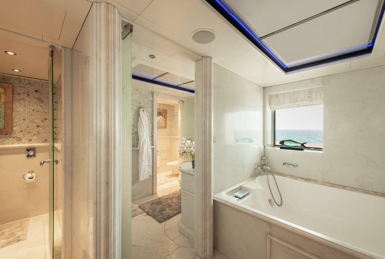 a bathroom with a tub and shower aboard MOONLIGHT II Yacht for Sale
