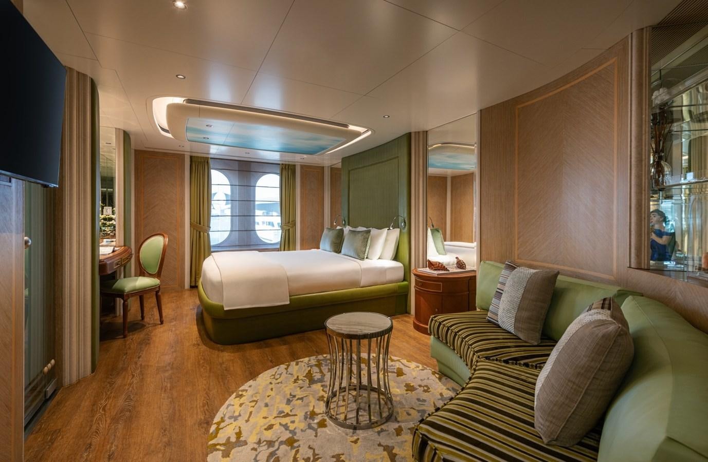 a living room with a couch and a table aboard MOONLIGHT II Yacht for Sale