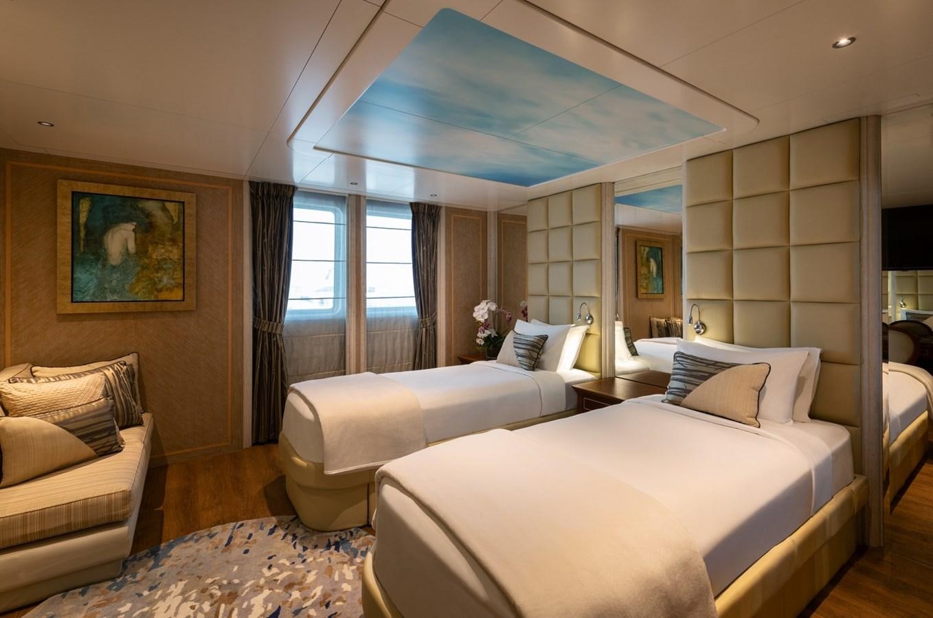 a room with a bed and a couch aboard MOONLIGHT II Yacht for Sale