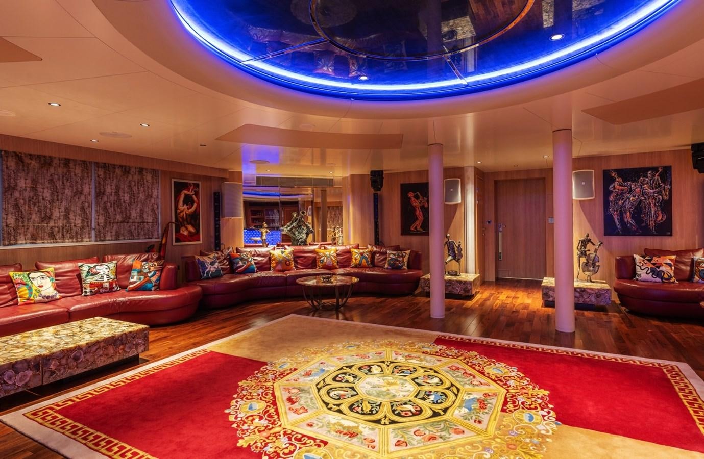 a large living room with a large chandelier aboard MOONLIGHT II Yacht for Sale