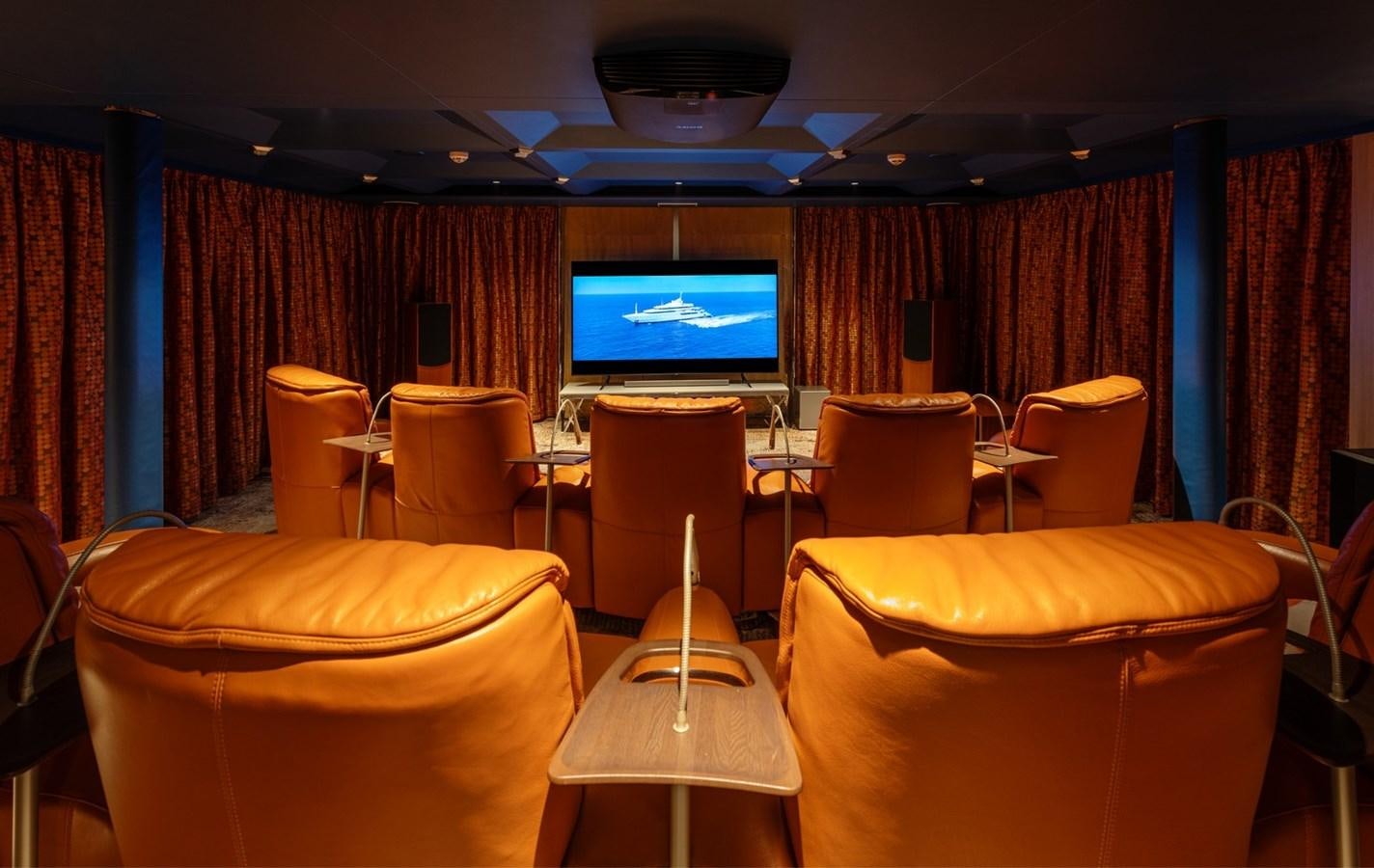 a room with chairs and a tv aboard MOONLIGHT II Yacht for Sale