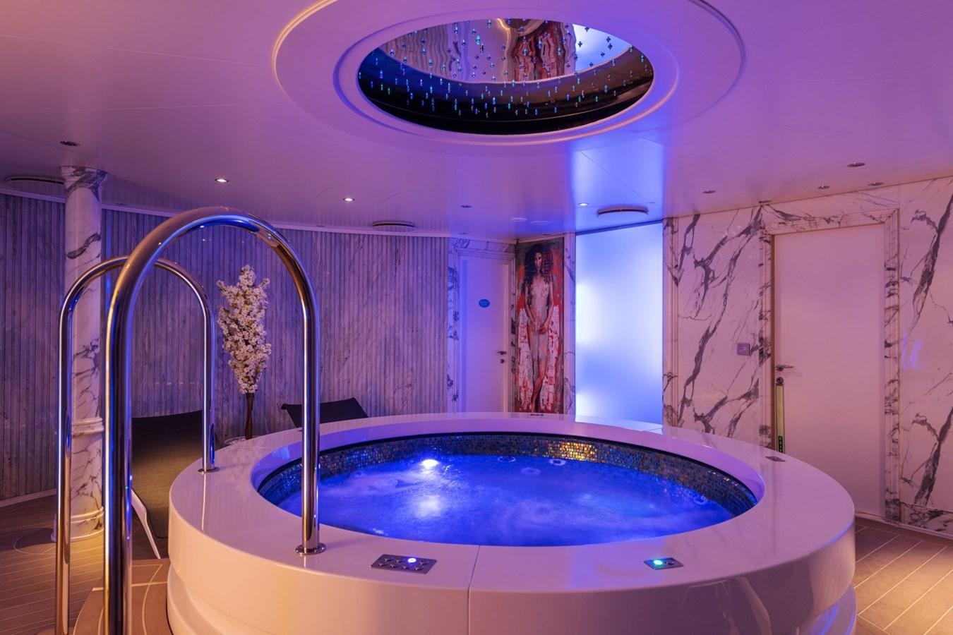 a large indoor swimming pool aboard MOONLIGHT II Yacht for Sale