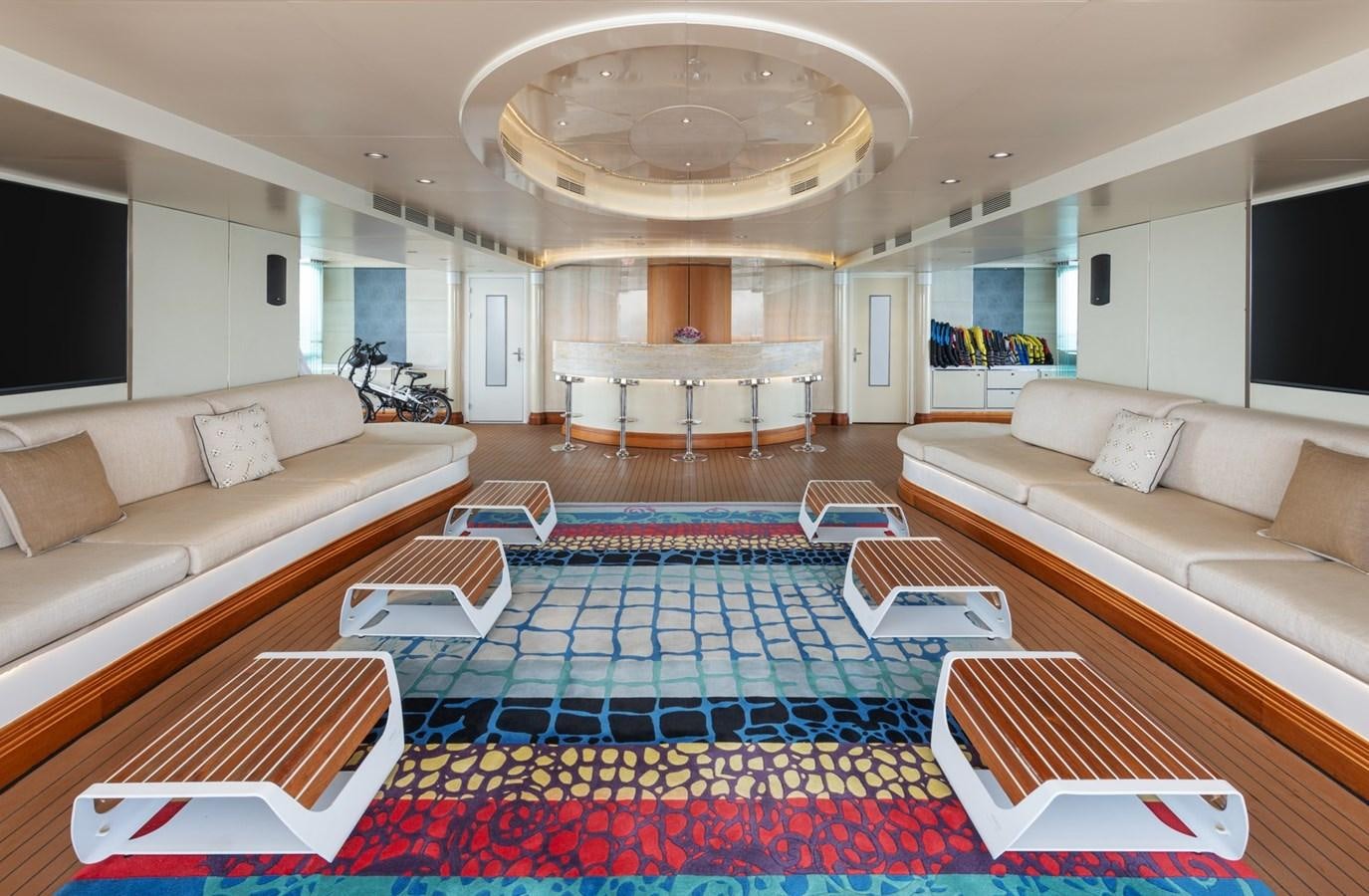 a living room with a rug and a rug aboard MOONLIGHT II Yacht for Sale