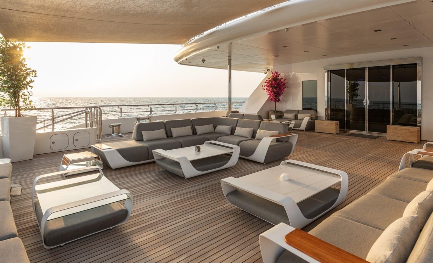a large living room with a large balcony aboard MOONLIGHT II Yacht for Sale