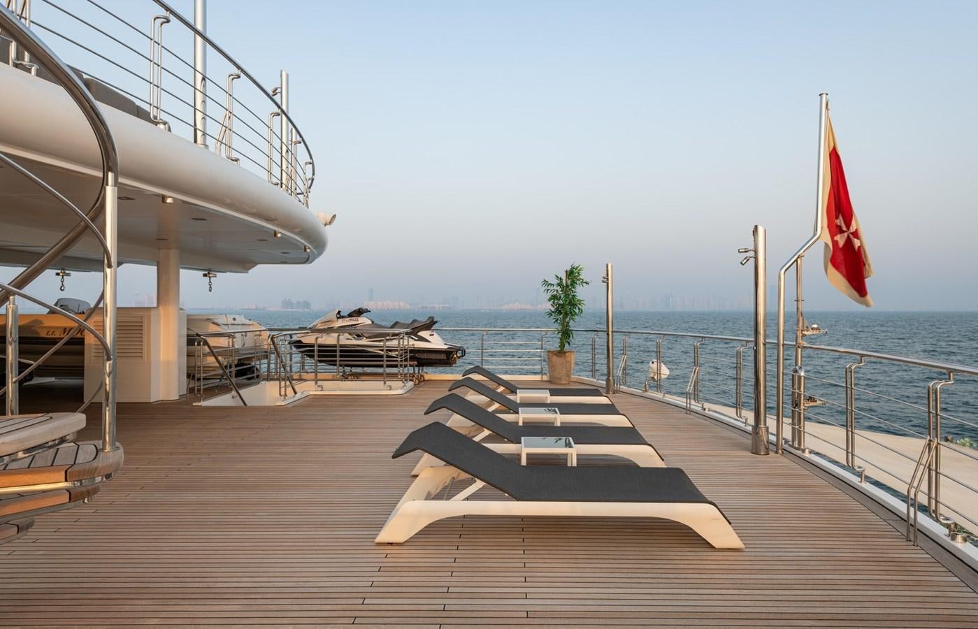 a wooden dock with a flag on it aboard MOONLIGHT II Yacht for Sale