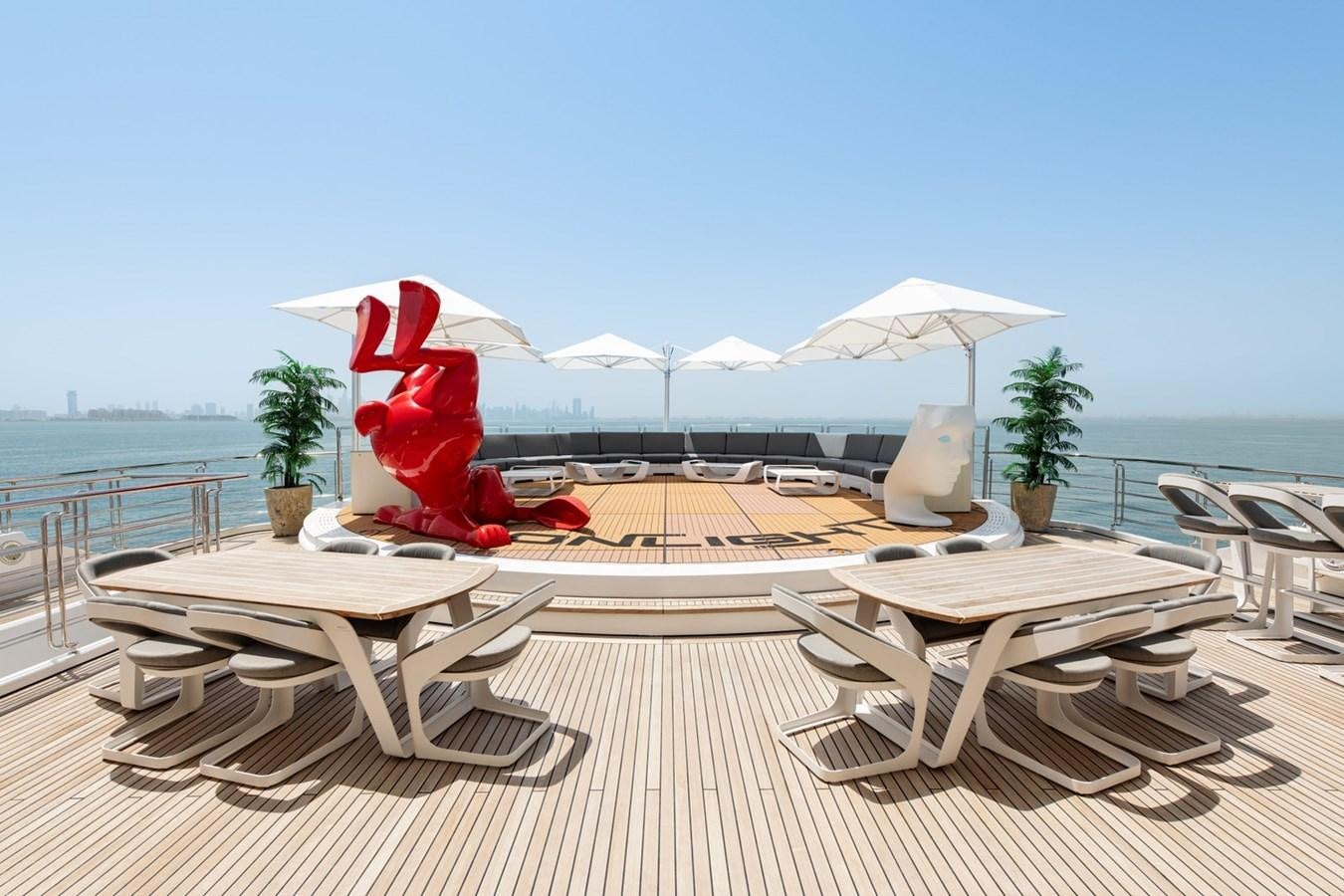 a red heart sculpture on a patio aboard MOONLIGHT II Yacht for Sale