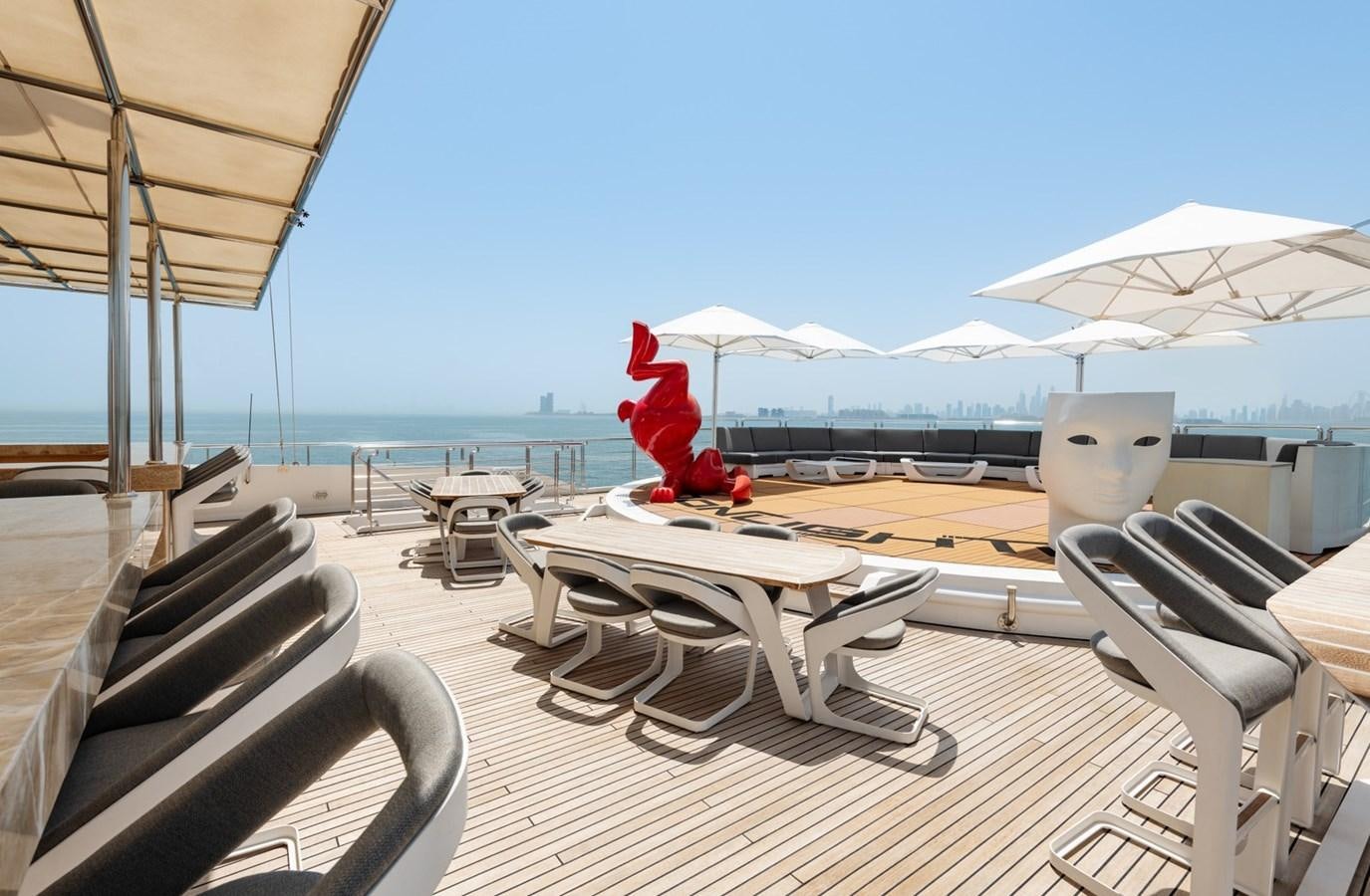 a deck with chairs and umbrellas aboard MOONLIGHT II Yacht for Sale