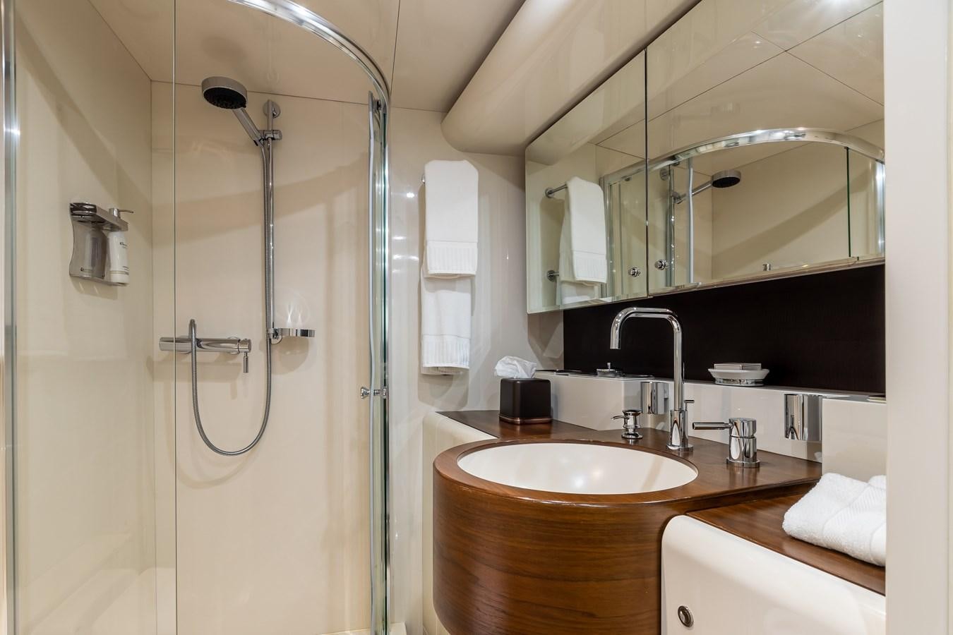a bathroom with a shower and sink aboard GRANDEUR Yacht for Sale