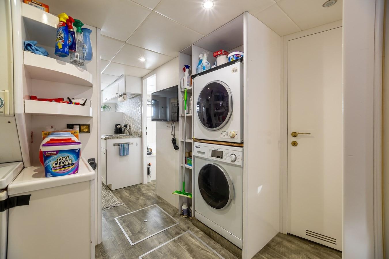 a laundry room with a washer and dryer aboard GRANDEUR Yacht for Sale